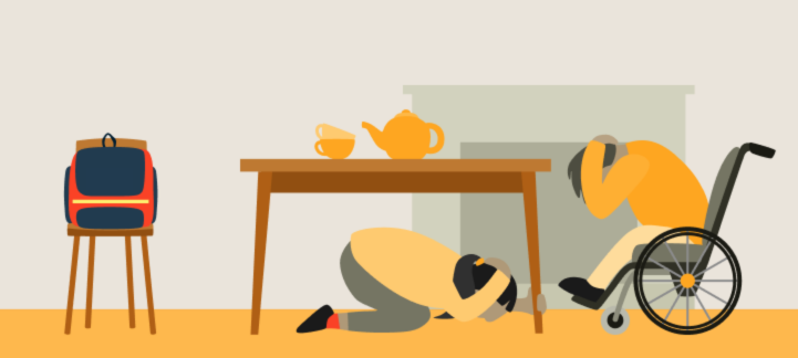 Two people in a dining room sheltering from an earthquake. A person who uses a wheelchair is covering their head and leaning forward. A person is kneeling under a table covering their head and holding onto the table leg